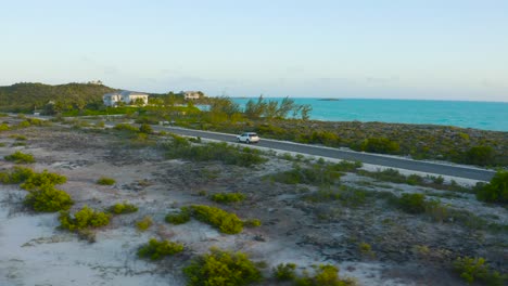Drone-following-the-car-driving-in-beautiful-street-of-Turks-and-Caicos-Islands