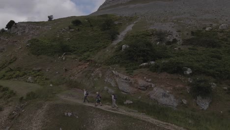 Three-old-men-are-walking-along-the-mountainside