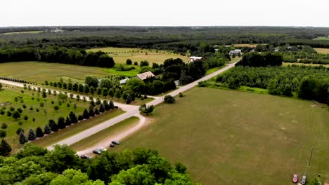 Panoramic-aerial-view-of-rural-countryside-with-farm,-farm-fields-and-gorgeous-nature-in-Sturgeon-Bay,-Wisconsin