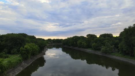 A-stroll-down-a-river-that-feeds-the-Mississippi-on-the-southern-side-of-the-Twin-Cities-in-Minnesota-follows-a-bike-trail-with-bikers-riding-on-the-bottom-left-side