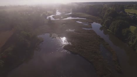 Flying-Backwards-Over-The-Winding-River-on-a-Sunny-Morning