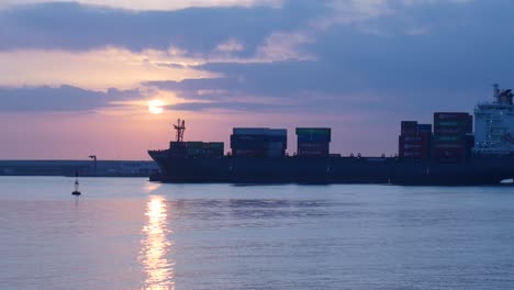 Ship-passing-through-an-industrial-port