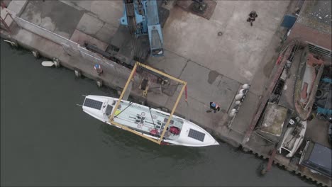 Crane-Loading-rowing-boat-into-the-sea