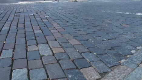 Car-Traffic-on-Granite-Pavement-in-Vilnius-Old-Town