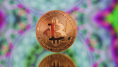 Bitcoin-De-Oro-Brillante-En-Un-Suelo-De-Espejo-Con-Un-Colorido-Fondo-Hipnótico