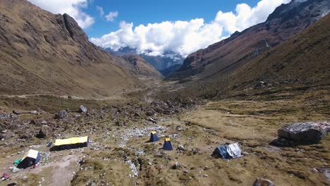 Aerial-View-Of-Camp-Setup-In-Salkantay-Pass-Valley,-The-Peruvian-Andes,-Peru