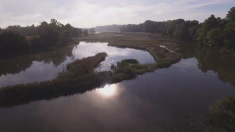 Flight-Forward-Over-The-Winding-River-On-A-Sunny-Summer-Morning