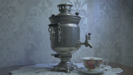 Hot-Water-Poured-From-Vintage-Samovar-Overflows-To-Top-The-Cup