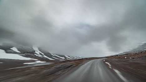 A-drive-on-the-mountaineous-plateau-on-country-road-258-towards-Stryn,-Norway