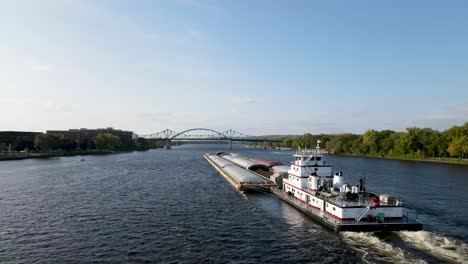 Close-up-of-a-bare-transporting-cargo-down-the-Mississippi-river-in-La-Crosse,-Wisconsin