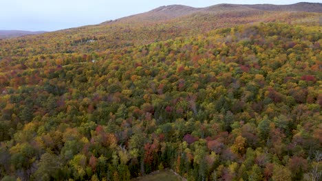 Breathtaking-Nature-Scenery-of-Colorful-Autumn-Foliage-in-New-England---Aerial-Flying-view