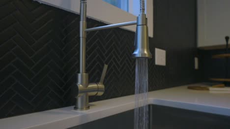 Tight-shot-of-the-running-kitchen-faucet