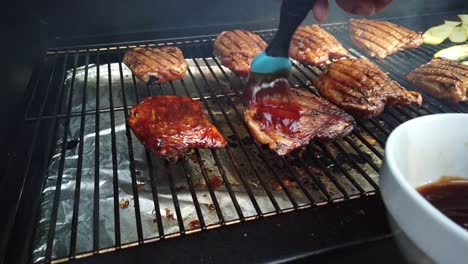 Brushing-BBQ-sauce-on-smoked-chicken
