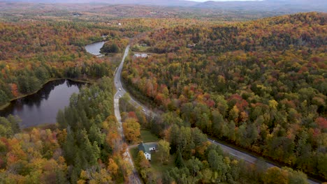 Epic-Aerial-View-above-New-England-Interstate-with-Beautiful-Fall-Color-Forest