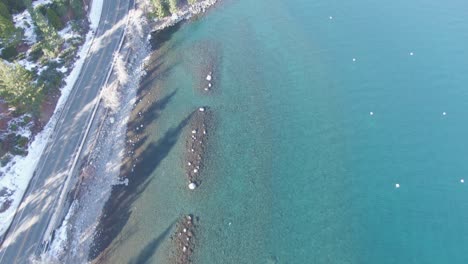 Crystal-Clean-Blue-Lake-Tahoe-Water-Northern-California-Slow-Truck-from-Aerial-Drone-Flight