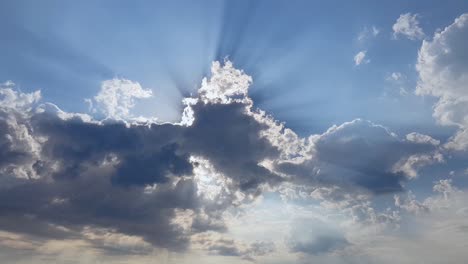 Blue-Sky-With-Cloudscape-Backlit-Bright-Sunlight-Through-Summer