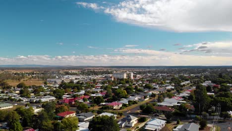 Aerial-view-over-the-townscape,-towards-the-tallest-structure,-the-Peanut-Silo-of-Kingaroy,-sunny-day,-in-Australia---rising,-drone-shot