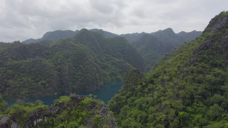 A-drone-video-of-a-tropical-setting-over-the-ocean-and-jungle-on-an-overcast-day-in-the-Philippines-3