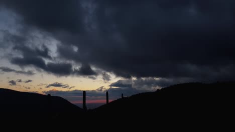 Dark-Clouds-Moving-Fast-In-The-Sky-On-A-Sunset,-low-angle,-time-lapse