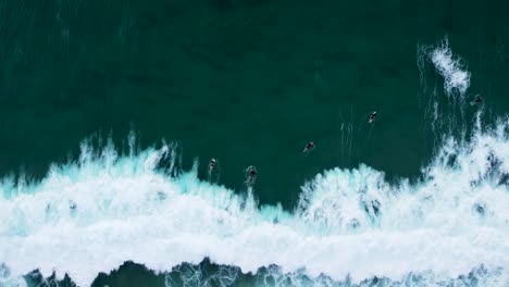 Drone-shot-of-big-wave-and-white-wash-ocean-shot-with-surfers-and-bodyboarders-duck-dive-at-Lakes-Beach-Budgewoi-NSW-Australia-Central-Coast-3840x2160-4K