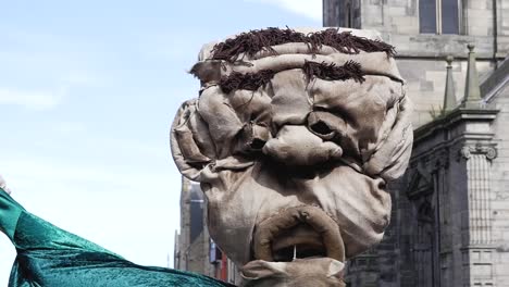 Slow-motion-shot-of-Toy-Puppet-Face-in-Edinburgh-Old-town-Markets-Scotland-Castle-UK-1920x1080
