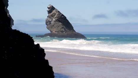 Slow-motion-still-shot-of-Praia-Da-Adraga-Beach-ocean-waves-and-cliff-rocks-in-Sintra-Almoc-ageme-Portugal-Europe-1920x1080-HD