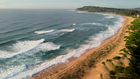 Drone-view-pan-shot-over-Shelly-Beach-Coast-line-Ocean-Waves-Surf-Central-Coast-NSW-Australia-3840x2160-4K