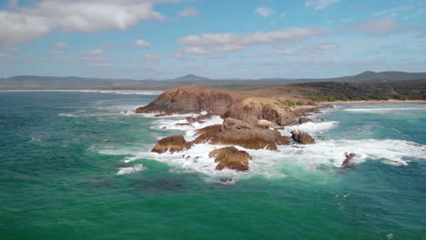 Aerial-drone-view-towards-the-Look-At-Me-Now-Headland-bay,-in-sunny-Australia