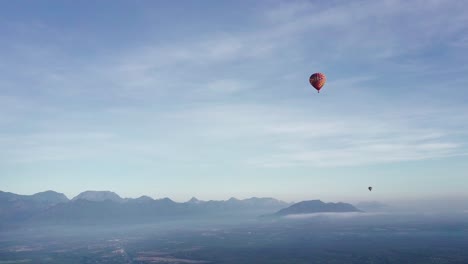 Hot-air-balloon,-Sierra-Madre-Mountains,-Montemorelos,-Mexico,-drone-scenic-shot