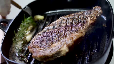 Rib-eye-steak-fried-on-hot-pan-4K