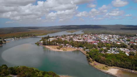 Aerial-view-over-the-river-at-the-Evans-Head-village---tracking,-drone-shot