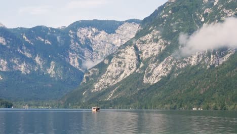 Slow-motion-landscape-still-shot-of-boat-on-Lake-Bohinj-with-Slovenia-Mountains-Triglav-National-Park-Valley-Ljubljana-Europe-1920x1080-HD