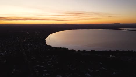 Drone-aerial-pan-landscape-shot-of-Tuggerah-Lakes-Long-Jetty-Afternoon-sunset-and-suburbs-Central-Coast-NSW-Australia-3840x2160-4K