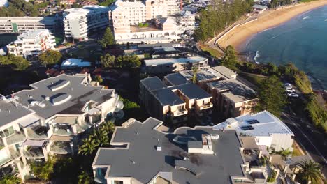 Drone-aerial-pan-shot-across-hotels-and-Crowne-Plaza-Terrigal-Beach-town-tourism-Central-Coast-NSW-Australia-3840x2160-4K