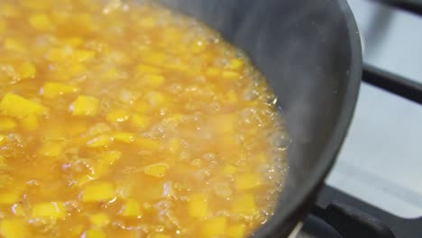 Close-up-of-pumpkin-risotto-bubbling-and-reducing