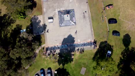 Drone-aerial-pan-bird's-eye-shot-of-Narara-Skatepark-with-BMX-and-skateboarders-Wyoming-Oval-Gosford-Central-Coast-NSW-Australia-3840x2160-4K