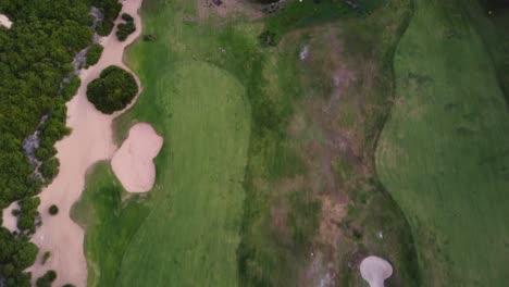 Drone-pan-shot-across-greens-with-sand-bunkers-Shelly-Beach-Golf-Course-Central-Coast-NSW-Australia-3840x2160-4K