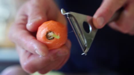 Chef-peeling-carrot-in-slow-motion