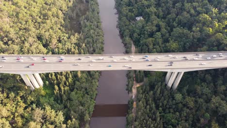 Drone-pan-aerial-shot-of-Mooney-Mooney-Creek-Bridge-Big-Dipper-M1-motorway-freeway-with-car-traffic-to-Sydney-from-Central-Coast-Hawkesbury-River-NSW-Australia-3840x2160-4K