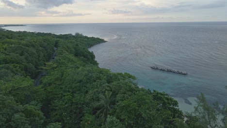Aerial-view-of-coastal-road-and-tropical-shore-of-Caribbean-Sea-on-Jamaica