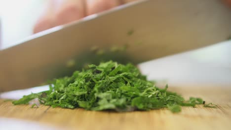 Close-up-of-mint-being-finely-chopped-by-chef
