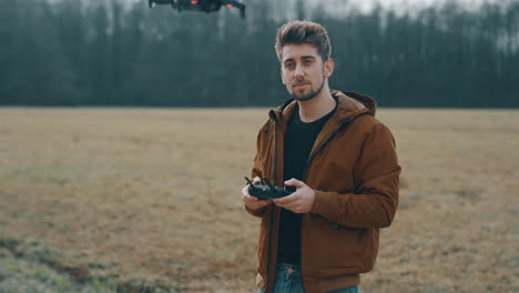 Young-man-flying-a-drone-outside-3