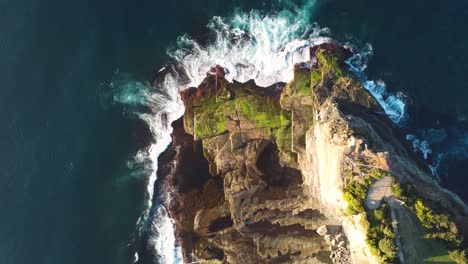 Drone-Bird's-eye-scenic-aerial-shot-of-The-Skillion-Pacific-Ocean-rocks-and-reef-Terrigal-tourism-coastline-Central-Coast-NSW-Australia-3840x2160-4K