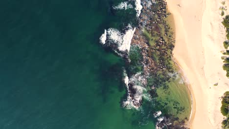 Drone-aerial-shot-bird's-eye-pan-view-of-coastline-ocean-reef-sandy-beach-Spoon-Bay-Wamberal-Point-Central-Coast-NSW-Australia-3840x2160-4K