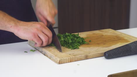 Finely-chopping-large-bunch-of-mint-herbs
