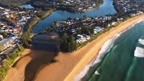 Drone-aerial-shot-of-Terrigal-lagoon-bridge-and-suburbs-of-Terrigal-and-Wamberal-Central-Coast-New-South-Wales-Australia-3840x2160-4K
