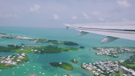 Bermuda-aerial-takeoff-view-from-plane-window-of-St-George's-with-turquoise-water-around-islands-in-St-George's-Harbour
