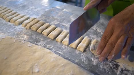 Chef-cutting-dough-preparing-for-Thai-Style-Chinese-doughnuts-Pa-Tong-Go