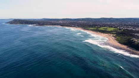 Sky-drone-aerial-landscape-shot-of-Beautiful-coastline-headland-Pacific-Ocean-Shelly-Beach-Central-Coast-NSW-Australia-4K