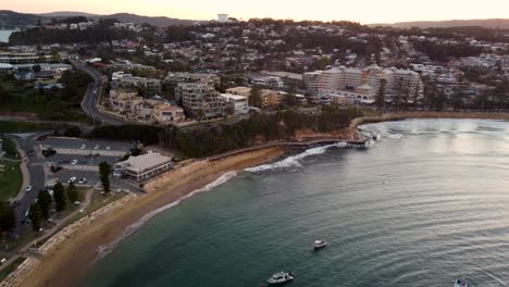 Drone-aerial-coastline-shot-of-Terrigal-Beach-The-Haven-in-the-afternoon-sun-Central-Coast-NSW-Australia-4K